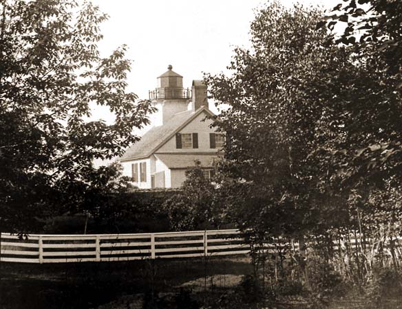 White fence and rear of lighthouse in 1930