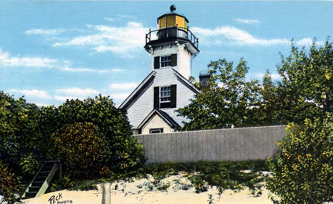 PictuLooking up at lighthouse from beach in 1950