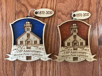 Two custom wood ornaments of lighthouse