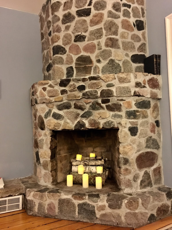stone fireplace inside with candles
