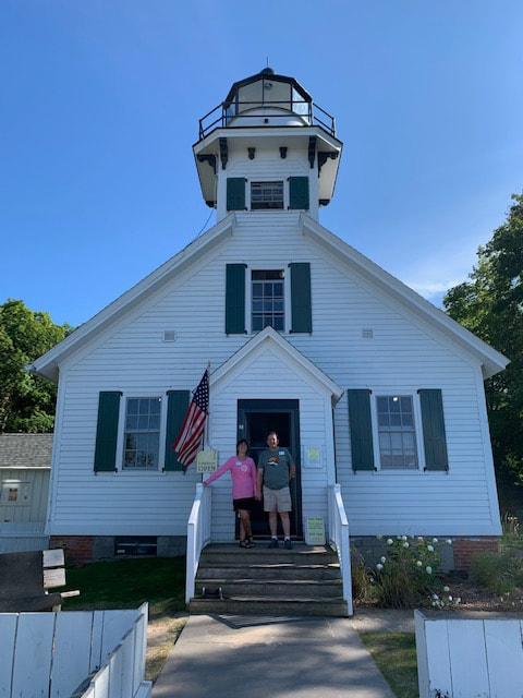 Lighthouse keepers Dave and Deb standing in gift shop